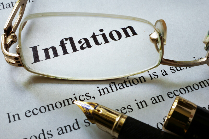 inflation_paper with word inflation and glasses. economic concept_canstockphoto39514246